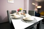 Dining area for 8 guests with brand new dining table chair set and crockery sets