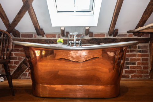 A lovely added bonus — two bedrooms offer beautiful copper freestanding baths for a cosy, indulgent experience