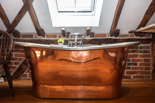 A lovely added bonus — two bedrooms offer beautiful copper freestanding baths for a cosy, indulgent experience