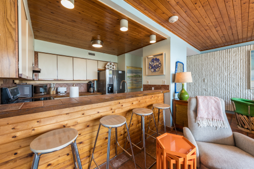Kitchen as seen from living area (4 bar stools) 