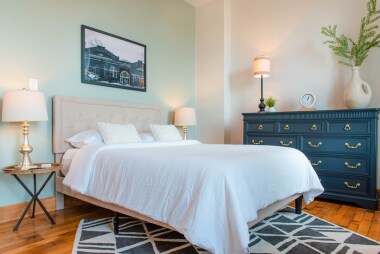 Bedroom 1 queen size bed and dresser for clothing. 