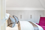 Beautifully styled bedroom with refined luxury finishes