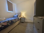 The perfect room for a solo traveller within a group. A cosy single bed, 40" Smart TV, private en-suite, and in-room tea and coffee – your own sanctuary in a spacious 7-bedroom house.
