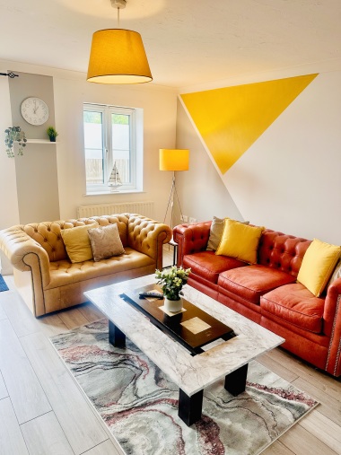 colourful living room with Chesterfield sofas