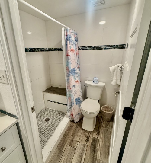 Walk in shower with bench, we provide shampoo, conditioner and body wash. 