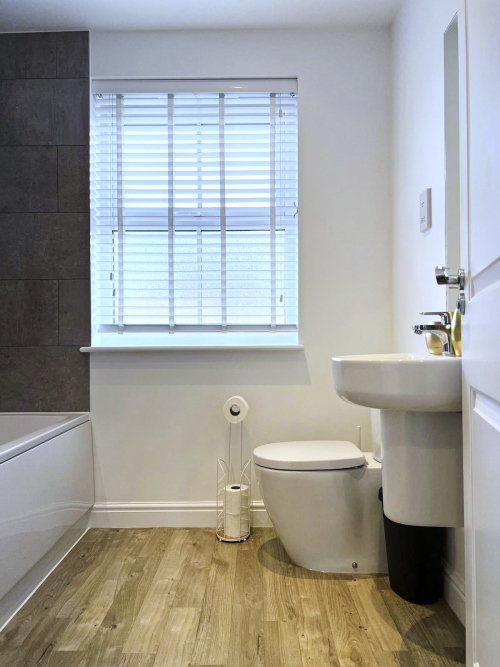 Spacious bathroom designed with comfort in mind.