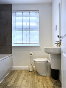 Spacious bathroom designed with comfort in mind.