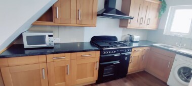Modern fitted kitchen with all essentials that you will need for your stay including oven, microwave, kettle and toaster. Also available for guest use fridge, freezer, washing machine and dishwasher.  Plates, mugs and drinking glasses. 