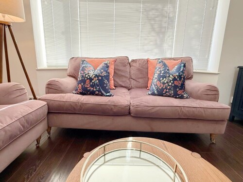 Unwind in this elegant living room, featuring two cozy two-seater sofas and a sleek TV. With warm lighting and stylish décor, it’s the perfect spot to relax after exploring.