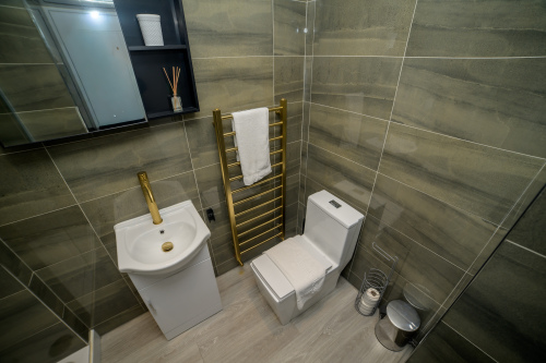 Relax and refresh in this clean and stylish bathroom space.