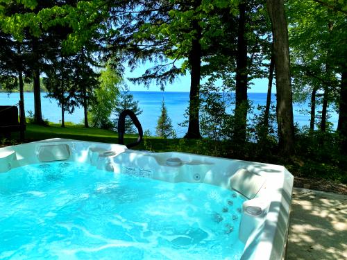 Hot Tub is outside and shared with the cottage next door like the boats. 