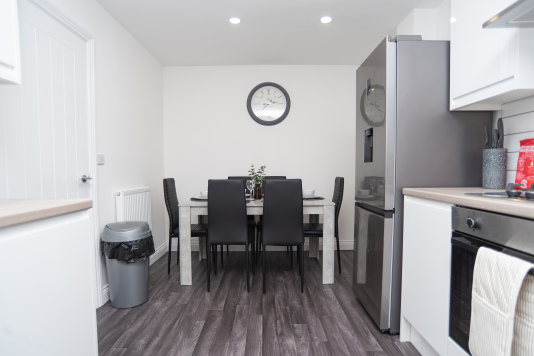 Kitchen/Diner table set with all plates, cutlery and kitchenware — everything you need for easy self-catering and a true home-from-home stay.