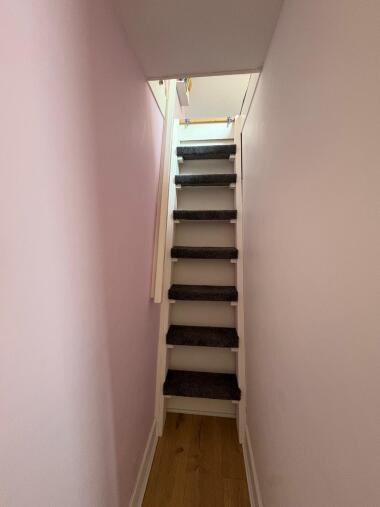 Stairs leading to the attic room