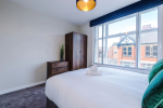 Comfortable bedroom with a king-size zip and link bed that can be separated into two singles upon request.