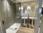 en suite shower room with double sink