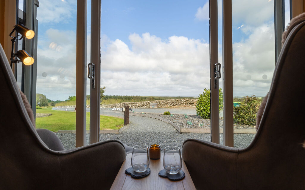 [{'Text': 'View from living room', 'CultureCode': 'en-GB'}] glamping cabins and grounds, photo 20 of 32