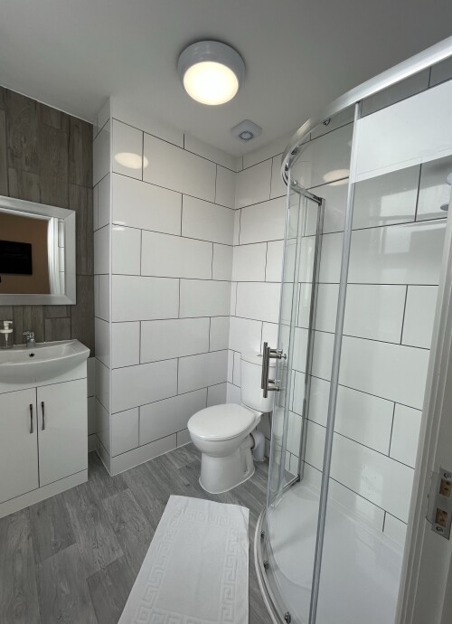 Studio 5 - Modern 3 piece bathroom with walk-in shower, wash basin and toilet