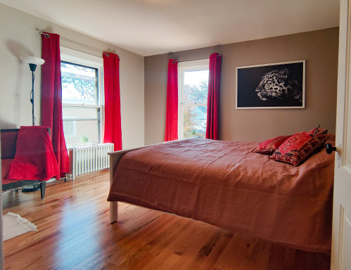The Redroom holds a queen size bed, a nice European sofa as well as ample storage space. 