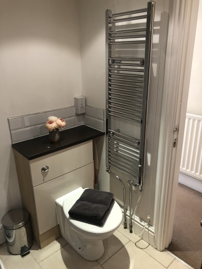 Family bathroom with corner bath and separate shower cubicle