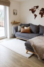 Relax on the sofa and enjoy peaceful views of the private patio garden through elegant French doors. Framed by beautiful mature trees, this bright and tranquil space is perfect for morning coffee, reading or unwinding after a day of exploring.