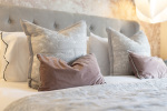Experience elevated living with this beautifully appointed master bedroom.