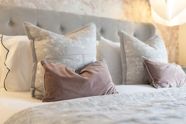 Experience elevated living with this beautifully appointed master bedroom.