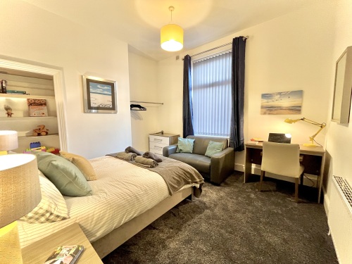 Bedroom 1  - A welcoming space for comfort and conversation.