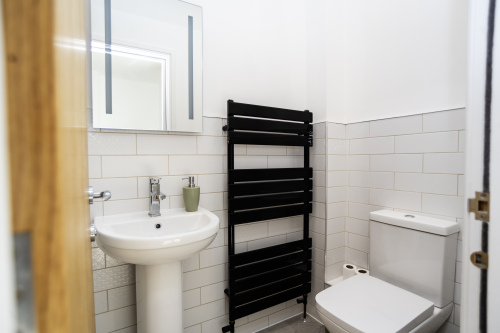 Handy Ground-Floor WC - Easily accessible toilet with towel rail, perfect for families and groups