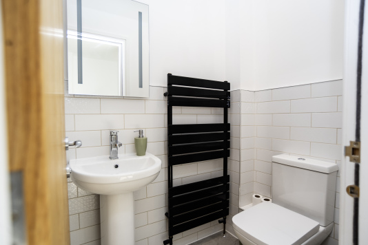 Handy Ground-Floor WC - Easily accessible toilet with towel rail, perfect for families and groups