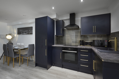 Well-appointed kitchen with essential appliances and ample workspace.