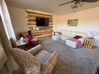 Living Room with a Smart TV for Your Streaming Services (Direct TV is Provided)