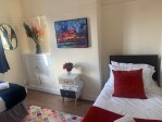 Spacious west facing bedroom with two singles on the ground floor (subject to request)