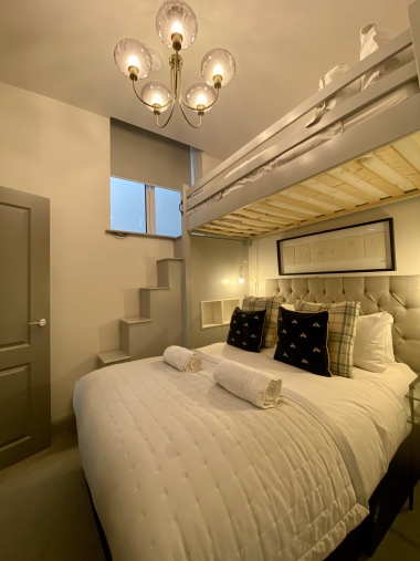 Second bedroom with double bed and single bed