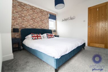 Spacious master bedroom with super king bed