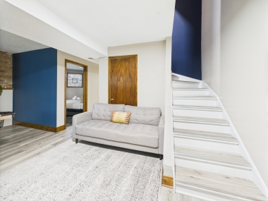 A casual lower-level lounge — where comfort takes center stage.