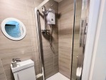 bathroom #1 enclosed shower 