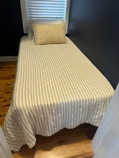 The smaller second bedroom provides a cozy space for extra sleeping, perfect for accommodating last-minute guests or creating a quiet retreat.