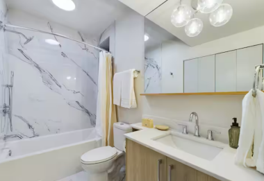 Light some candles, play smooth jazz, and sink into the deep soaking tub as your stress fades away. Surrounded by marble-inspired tiles and soft lighting, this serene bathroom offers the perfect escape to unwind and rejuvenate.