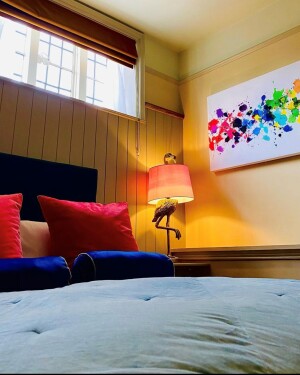Room 3 features flamingos and bold coloured art work. Perfect for a disco nap or an evening of indulging. 
