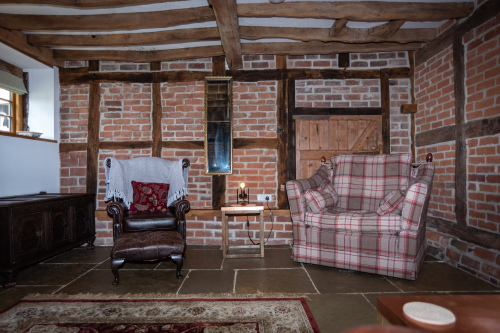 Comfortable country-style chairs that perfectly complement the cosy, rustic feel of the cottage