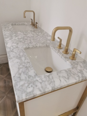Beautiful double marble vanity sink to the ground floor bedroom.