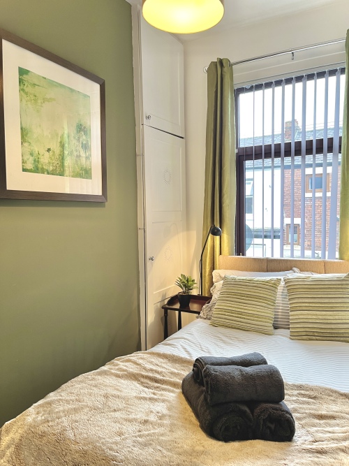 Bedroom 1 - Unwind effortlessly in this serene space with a plush small double bed