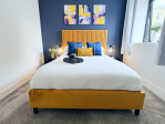 Master bedroom with king size bed and luxury hybrid memory foam mattress