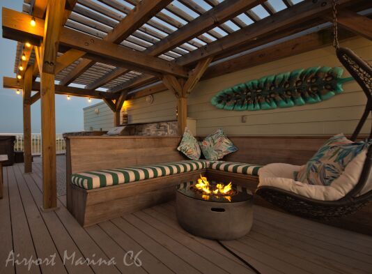 Rooftop lounge area has party lights