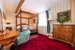 the master and commander bedroom with its 4 poster king sized bed
