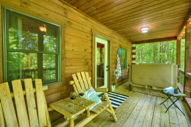 Back deck with outdoor seating and hot tub