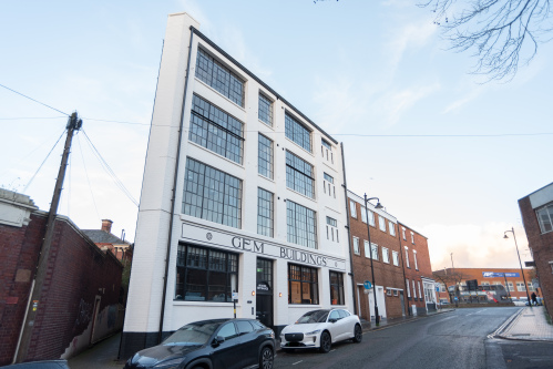 The exterior of the GEM Buildings, home to two luxury, modern and spacious apartments, sleeping a total of up to 18 guests across both properties, hosted by Affluxi.