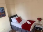 Spacious west facing bedroom with two singles on the ground floor (subject to request)
