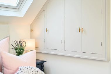 Luxury bedroom styling with beautifully curated cushions.