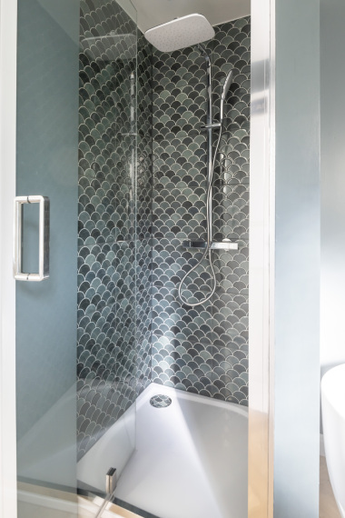 Designer bathroom with bright lighting and timeless sophistication.